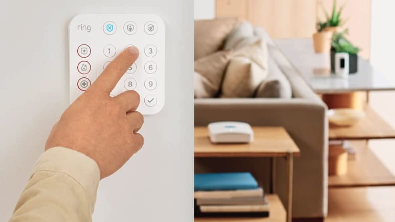 Person using touch keypad on house wall mounted alarm system.