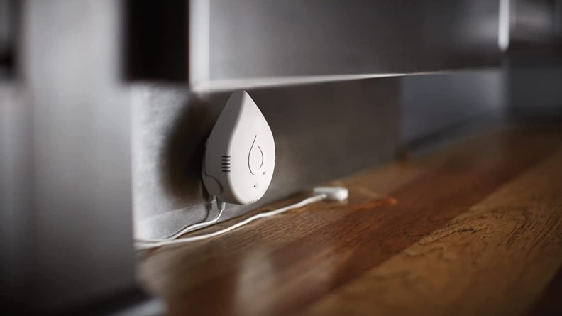Raindrop-shaped plug plugged into a grounded wall outlet.