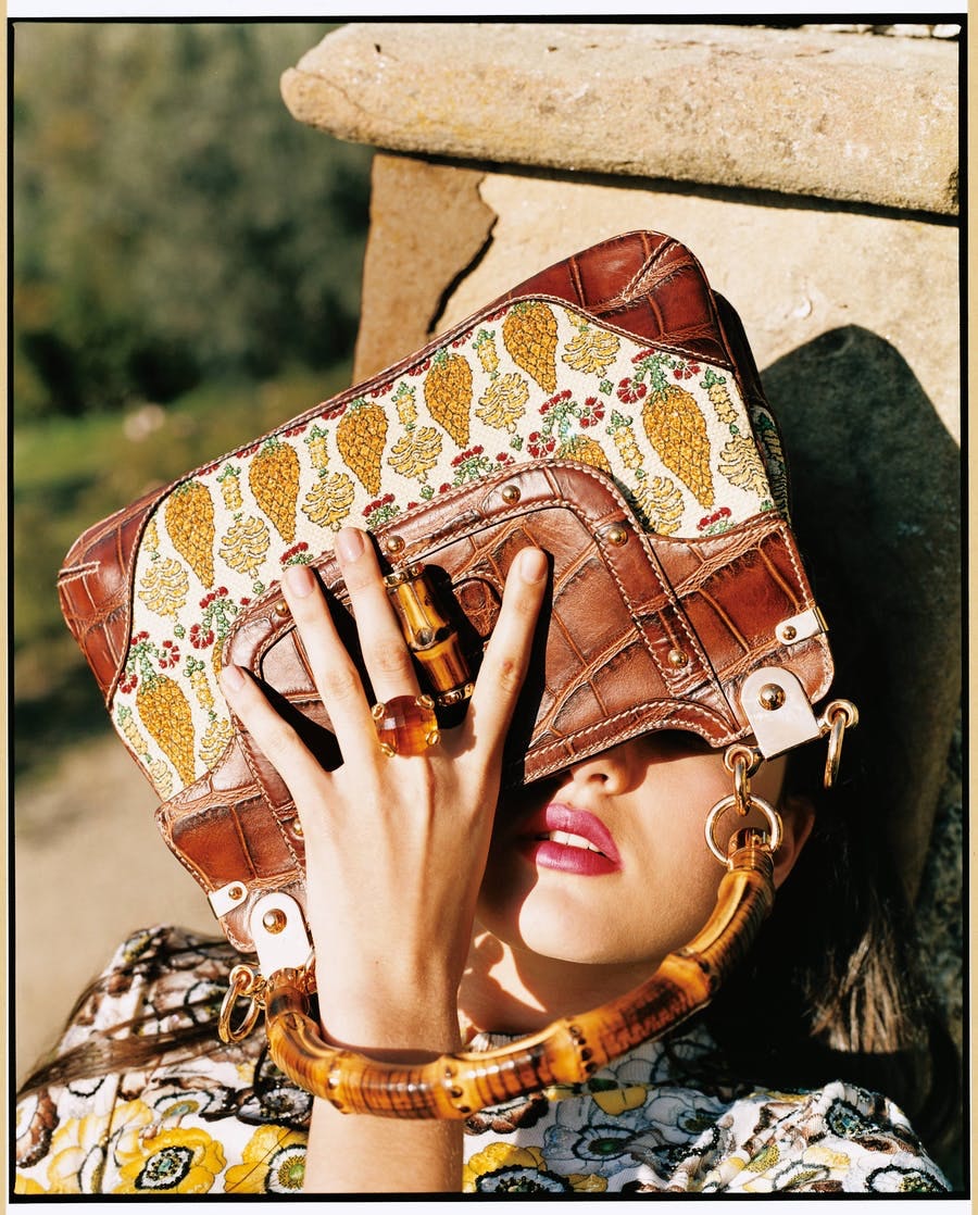 Model with floral pattern bag from Gucci by Frida Giannini, image © Arthur Elgort/Conde Nast via Getty Images