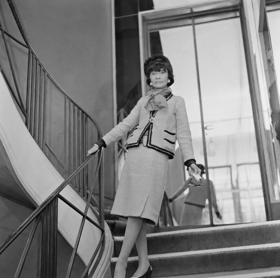 Coco Chanel in Paris, France, January 1963, in her classic Chanel suit, image © Michael Hardy / Daily Express / Hulton Archive / Getty Images