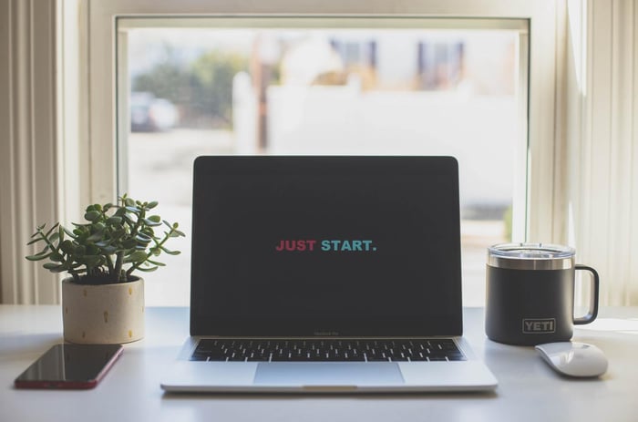 Laptop with 'Just Start' lettering