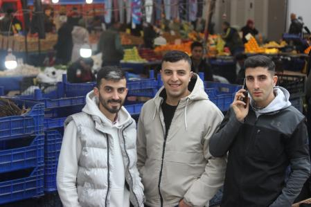 Kurdish youths who help their father in the Bagcilar market by day and work as security guards at the airport at night